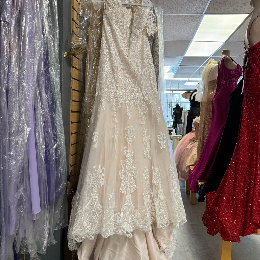 This is a brand new wedding dress very nice and elegant